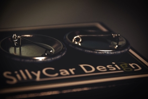 Photo of BSBPA First Friday's Fanatic buttons - closeup showing tiny text on sides of buttons.