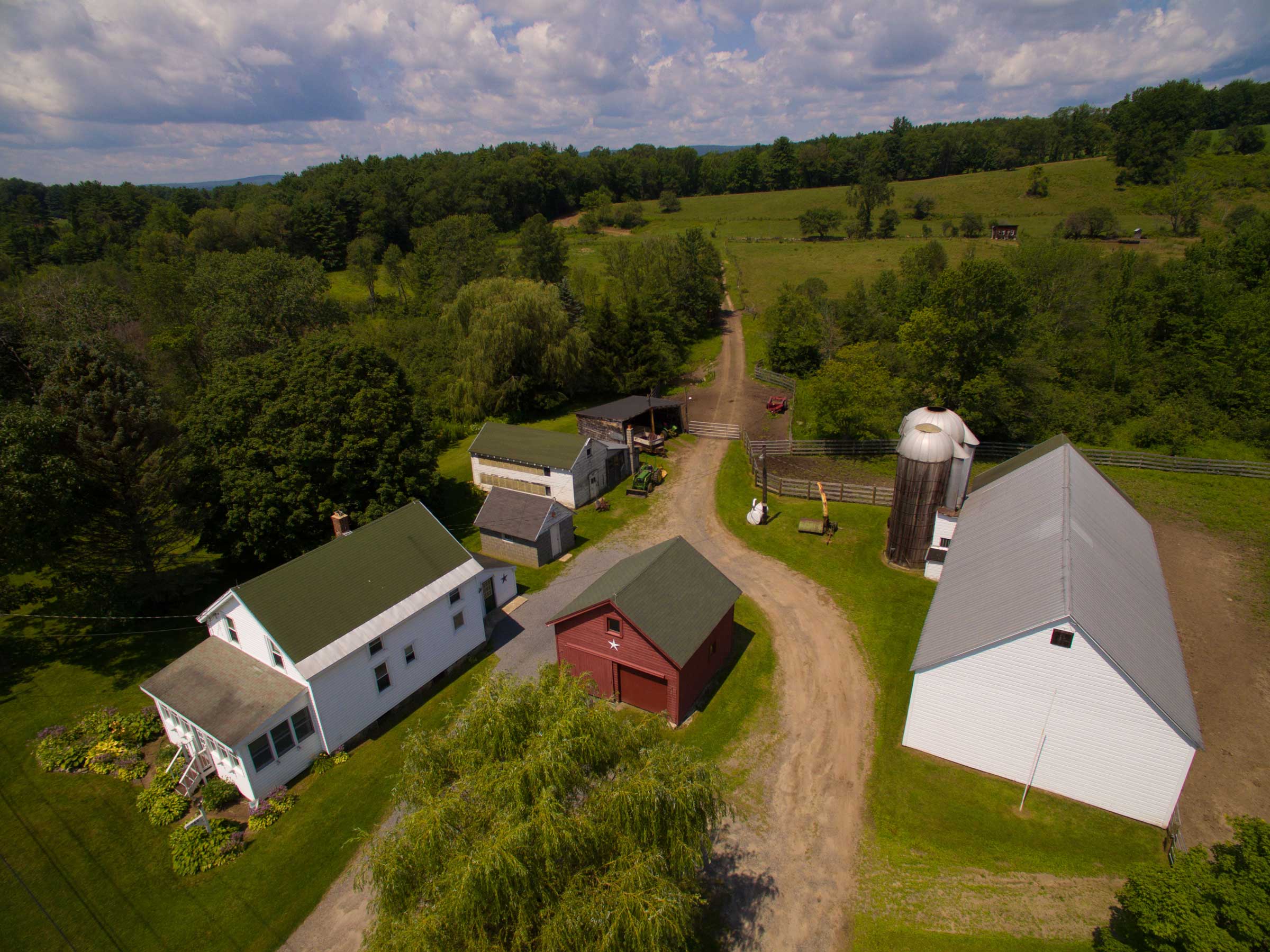 Aerial photo of house and out buildings at property in Mayfield, New York.