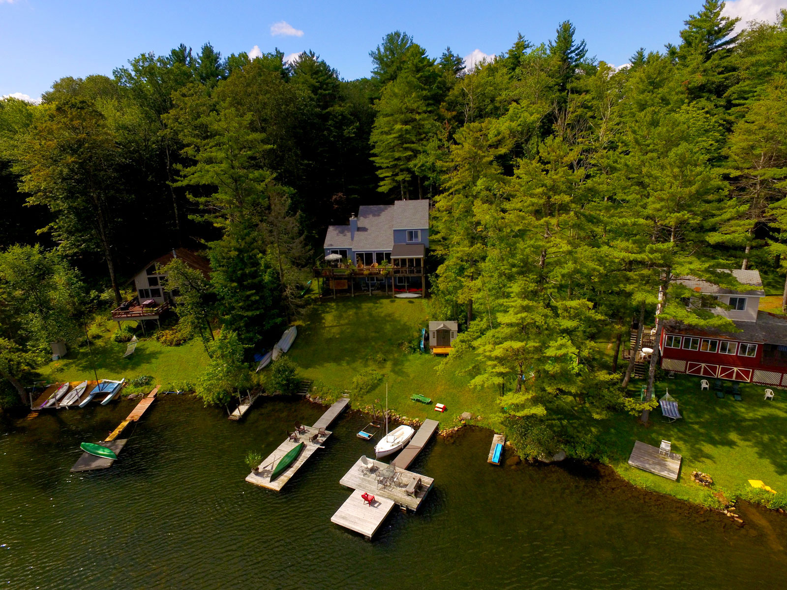 Aerial photo of front view of house and docks at property at Diamond Point on Galway Lake.