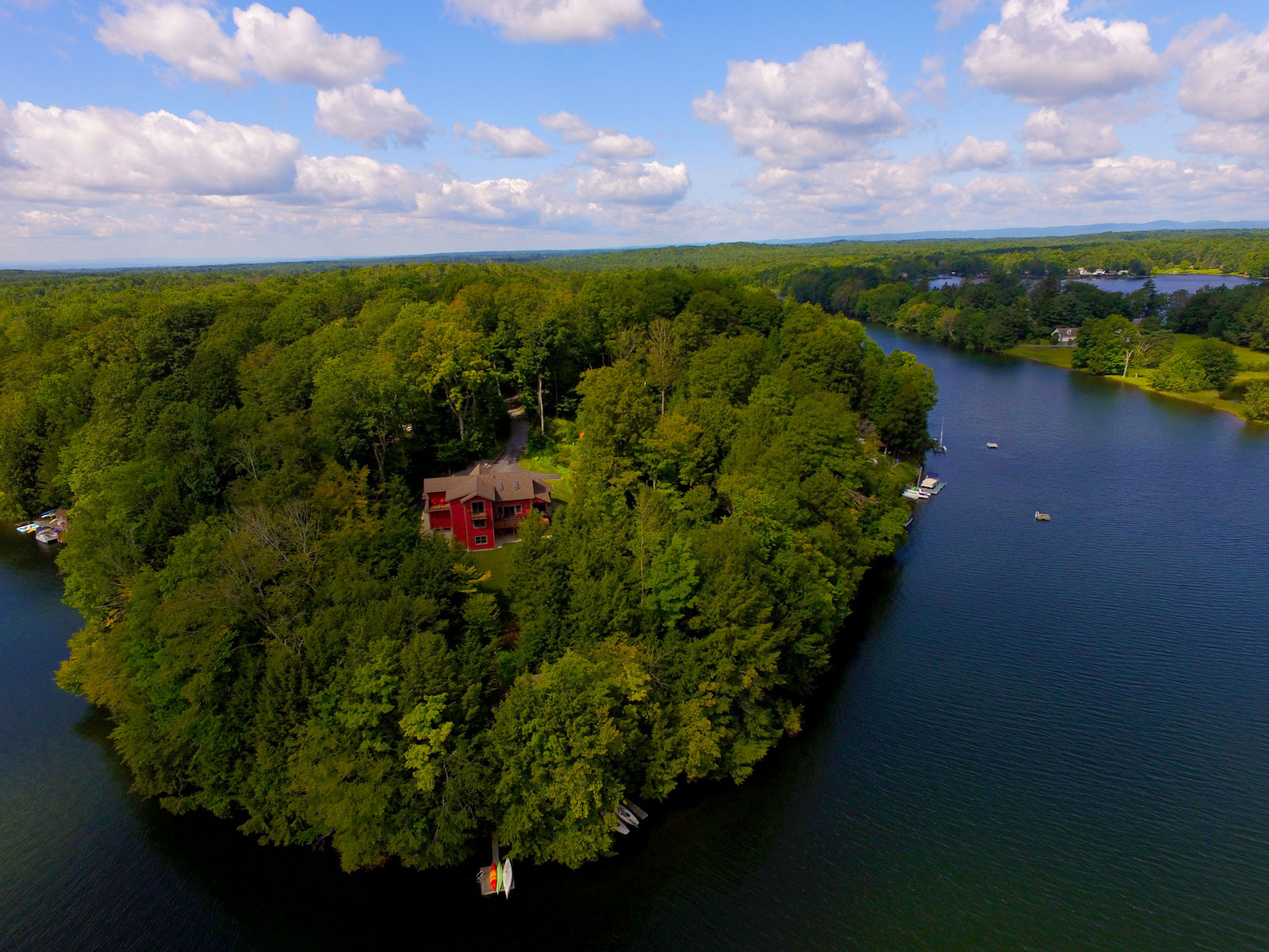 Aerial photo looking over a home on a peninsula at property on Galway Lake.