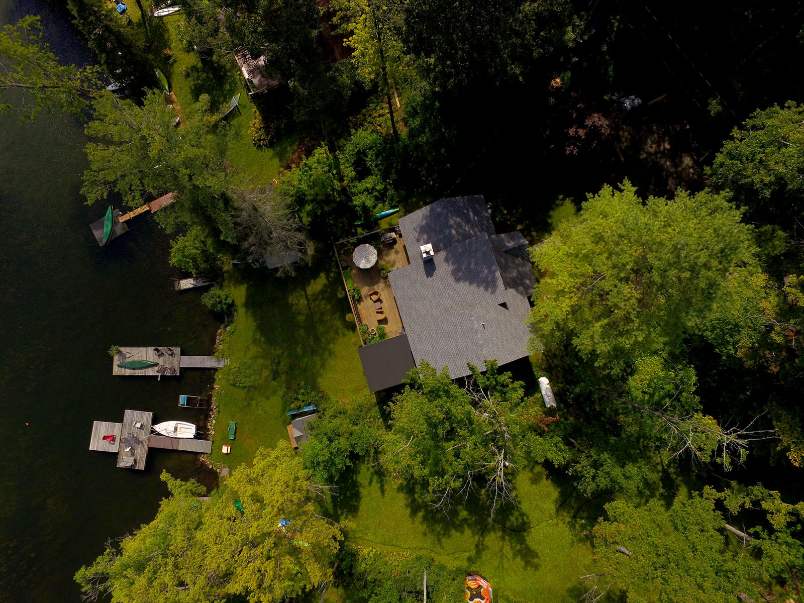 Top down photo of house and docks at property at Diamond Point on Galway Lake.