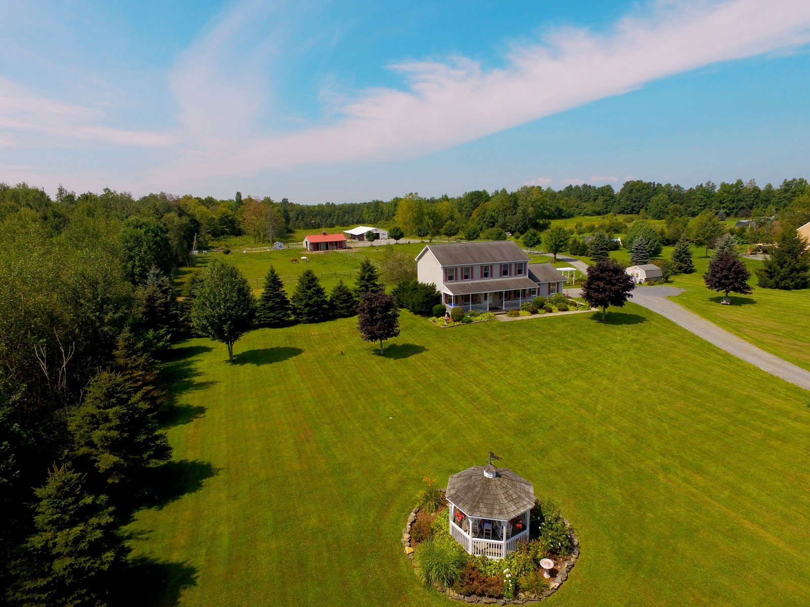 Aerial photo of front yard with gazebo at property in Amsterdam, New York.