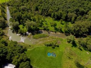 Aerial photo of straight down view of pond and creek at property in Canajoharie, New York.