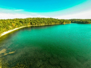 Aerial view of Lake Moreau with canoe off in the distance.